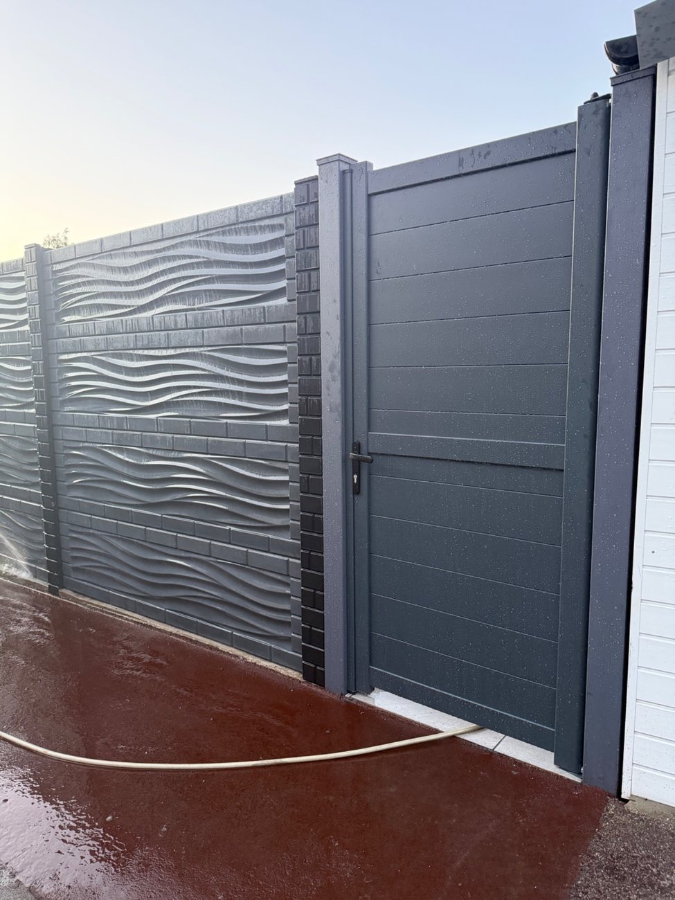 Completed Bristone concrete fence and gate installation