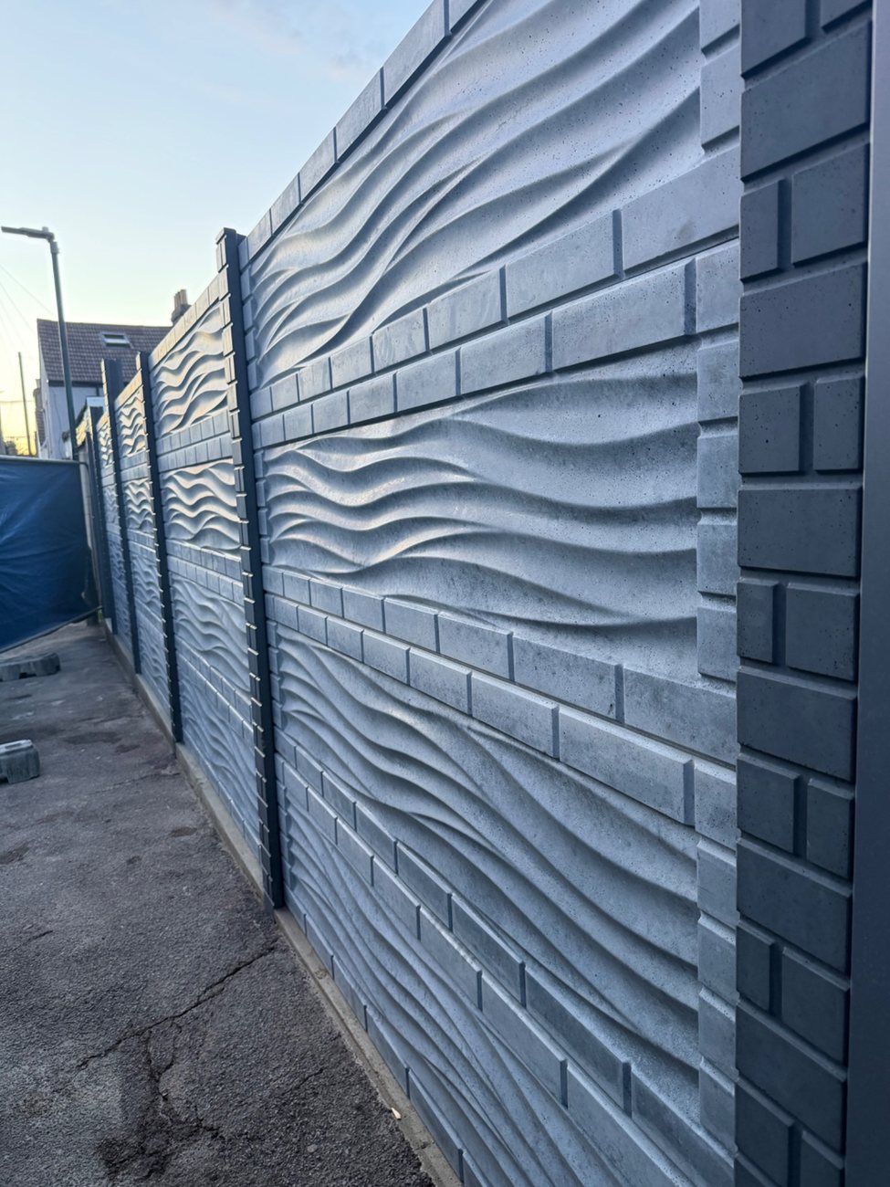 Detail of a completed reinforced concrete fence installation
